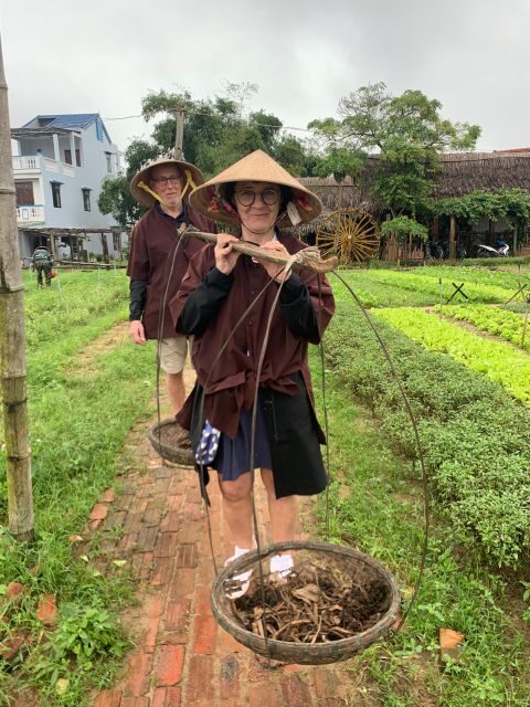 Farming with Farmers at ancient vegetable Village "Tra Que" - Water buffalo ride and basket boat row: the fun part with real character