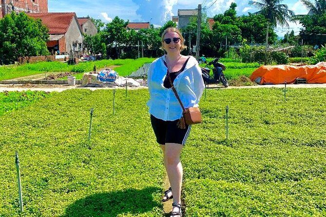 Hoi An bicycle tour to beautiful countryside - Tra Que vegetable village: hoe, water, and learn how food is grown