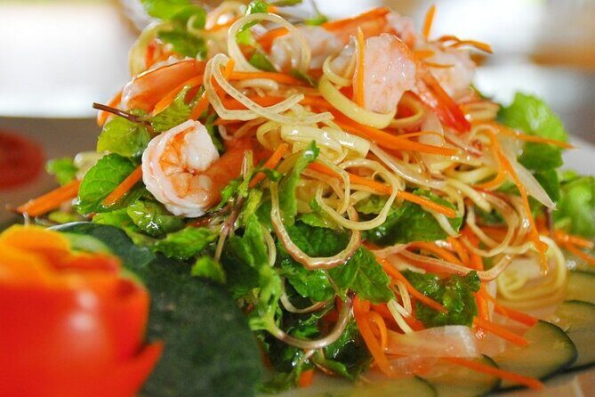 Hoi An Cooking Class With Market Tour and Bamboo Basket Boat Ride - Cooking school in a garden setting