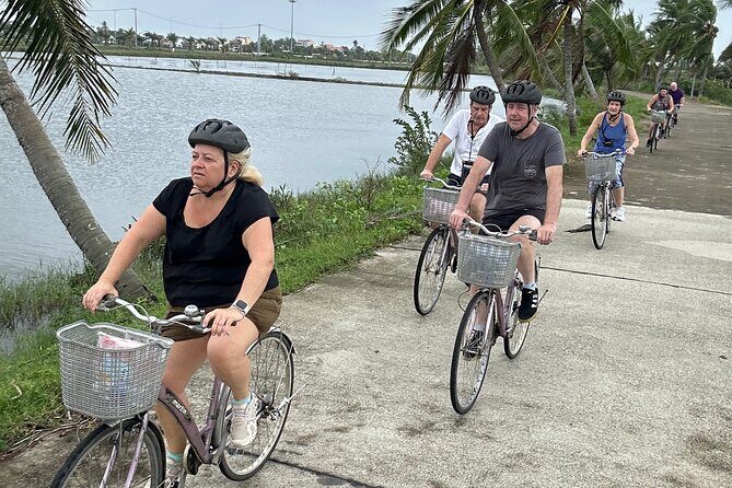 Hoi An countryside cycling Tour,Basket Boat-organic farming-lunch - Lunch in the countryside: chicken, fish, morning glory, papaya salad, and dessert